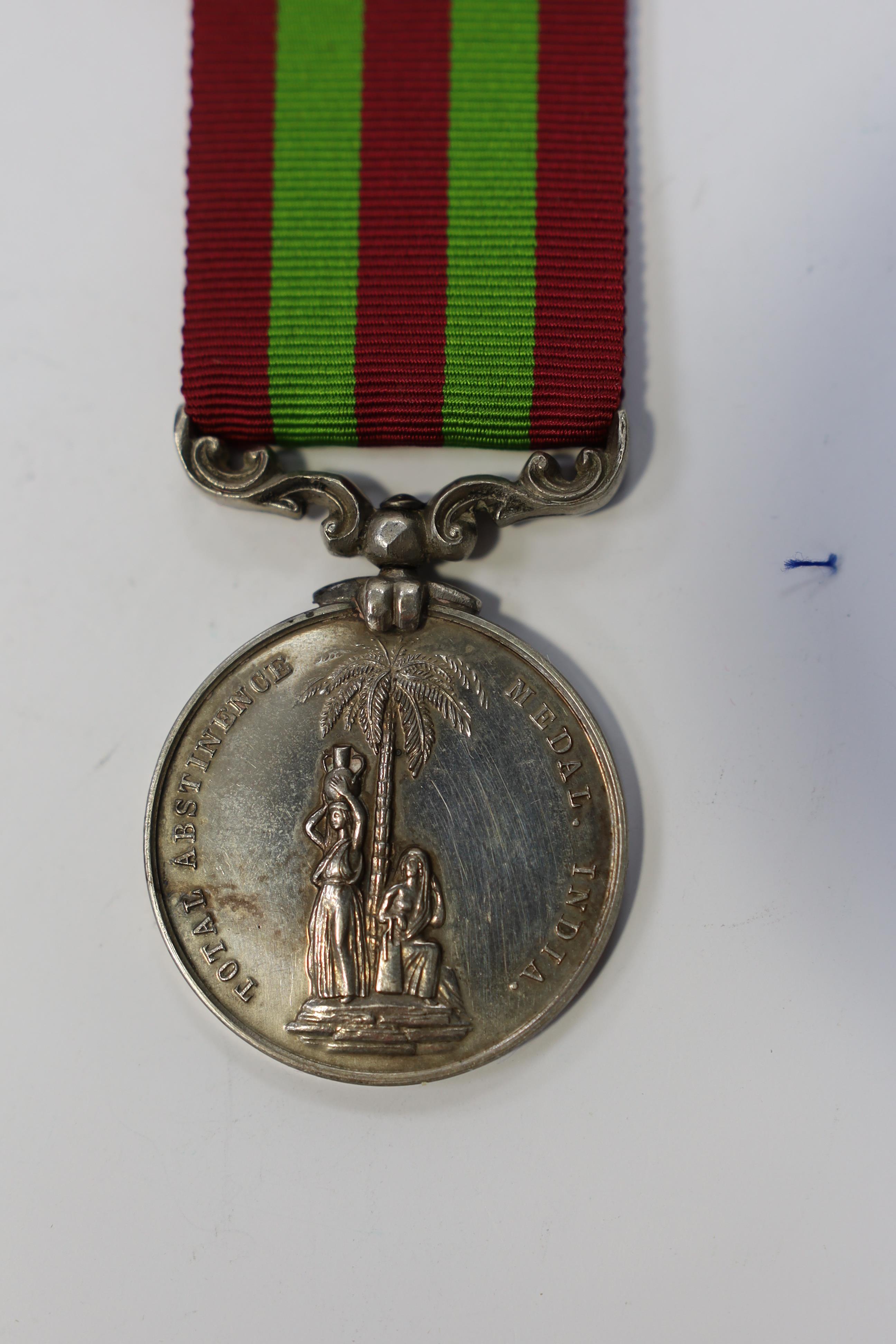 Replica medals; Khedive's Star 1884-6 and another undated; Ashanti star; Spink British North Borneo medal, a loose North West Frontier 1930-31 clasp and a Total Abstinence India medal 50-80